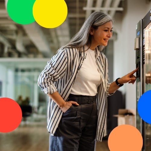 Lady choosing from vending machine