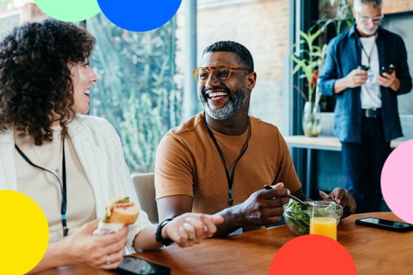 Man and women eating lunch and laughing
