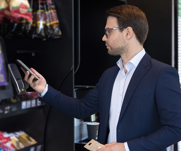 Government worker paying at micro mart