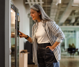 lady choosing from vending machine
