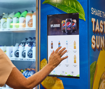 selecting a drink on vending machine